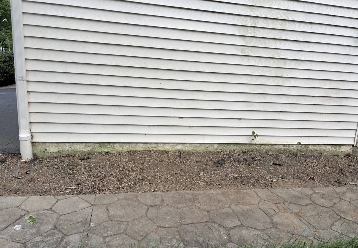 Landscape bed after overgrown bushes were pulled out in Lancaster PA